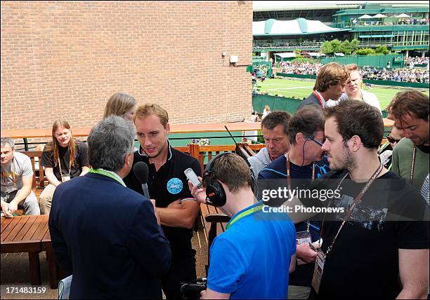 Steve Darcis of Belgium is interviewed by John Inverdale, the day after his victory against Nadal on day one of Wimbledon on 25 June, 2013 in London,...