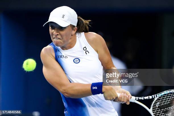 Iga Swiatek of Poland returns a shot in the Women's Singles Round of 32 match against Varvara Gracheva of France on day eight of 2023 China Open at...