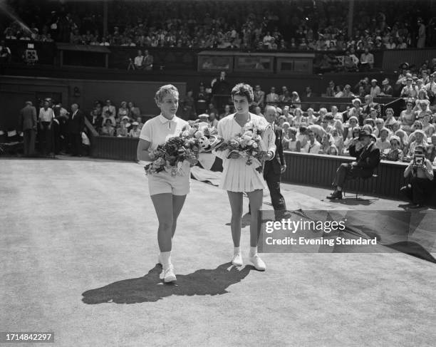 Brazilian tennis player Maria Bueno , winner of the women's singles tournament, with American runner up Darlene Hard at the Wimbledon Tennis...