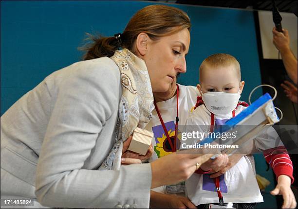 Princess Claire visits a sick child at Camp Tournesol on June 25, 2013 in Spa, Belgium. Camp Tournesol was created to help kids suffering from cancer.