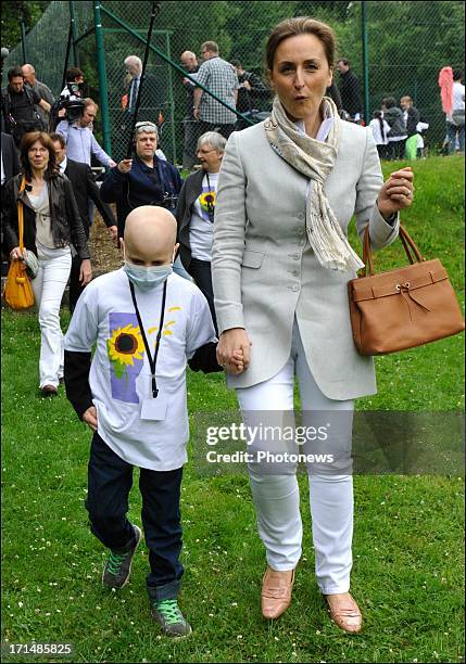 Princess Claire visits a sick child at Camp Tournesol on June 25, 2013 in Spa, Belgium. Camp Tournesol was created to help kids suffering from cancer.