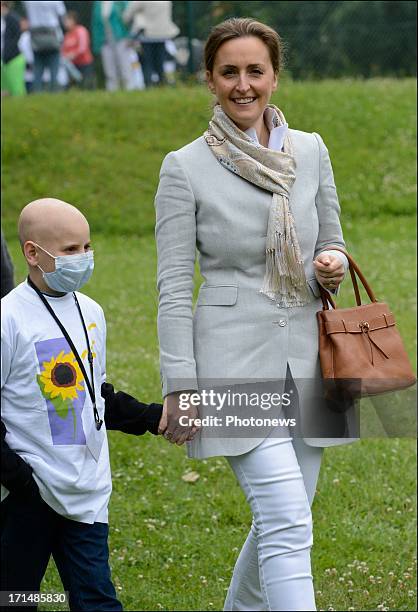 Princess Claire visits a sick child at Camp Tournesol on June 25, 2013 in Spa, Belgium. Camp Tournesol was created to help kids suffering from cancer.