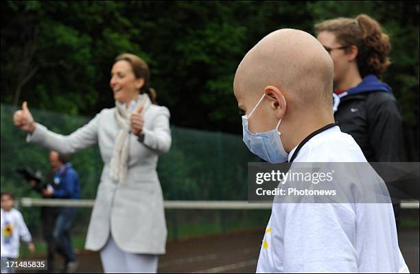 Princess Claire visits a sick child at Camp Tournesol on June 25, 2013 in Spa, Belgium. Camp Tournesol was created to help kids suffering from cancer.