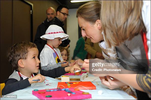 Princess Claire and Princess Lea visit children at Camp Tournesol on June 25, 2013 in Spa, Belgium. Camp Tournesol was created to help kids suffering...