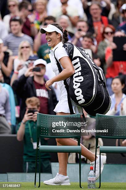 Laura Robson of Great Britain smiles as she leaves the court following her victory in the Ladies' Singles first round match against Maria Kirilenko...