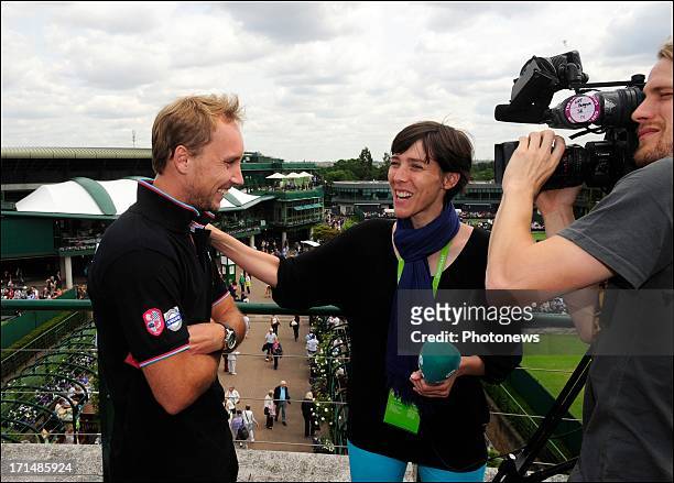 Steve Darcis of Belgium is seen talking to Inge Van Meensel of Sporza, the day after his victory against Nadal on day one of Wimbledon on 25 June,...