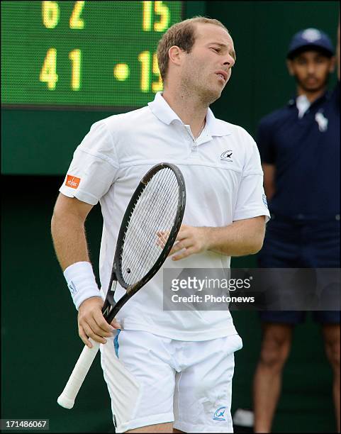 Olivier Rochus of Belgium reacts during his match against Kevin Anderson of South Africa on day two of Wimbledon on 25 June, 2013 in London, England.