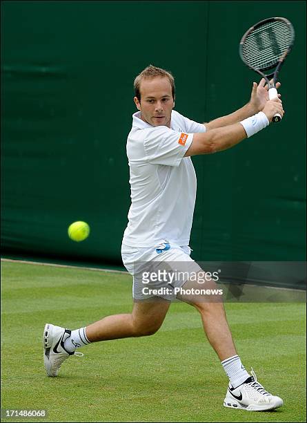 Olivier Rochus of Belgium plays a shot against Kevin Anderson of South Africa on day two of Wimbledon on 25 June, 2013 in London, England.