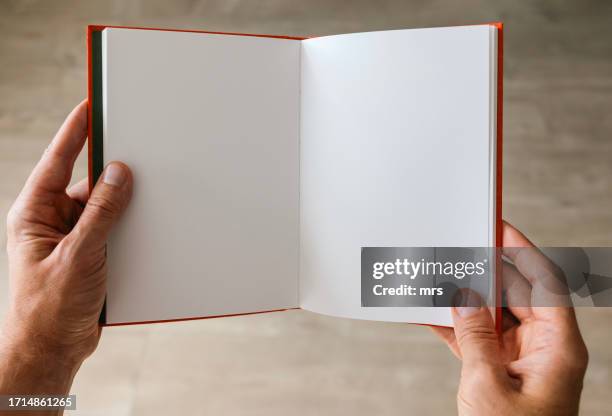 hands holding blank book - blank pages in open book overhead view stock pictures, royalty-free photos & images