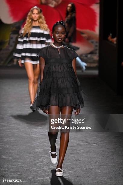 Adut Akech walks the runway during the Chanel Womenswear Spring/Summer 2024 show as part of Paris Fashion Week on October 03, 2023 in Paris, France.