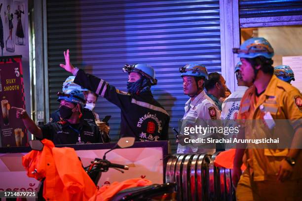 Emergency responders are seen outside the Siam Paragon mall as a shooting incident was still ongoing inside on October 03, 2023 in Bangkok, Thailand....