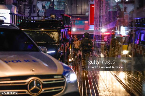 Police respond to a shooting incident inside the Siam Paragon mall on October 03, 2023 in Bangkok, Thailand. A man opened fire inside Siam Paragon,...