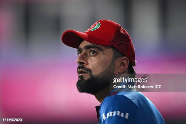 Rashid Khan of Afghanistan looks on during the ICC Men's Cricket World Cup India 2023 warm up match between Afghanistan and Sri Lanka at Barsapara...