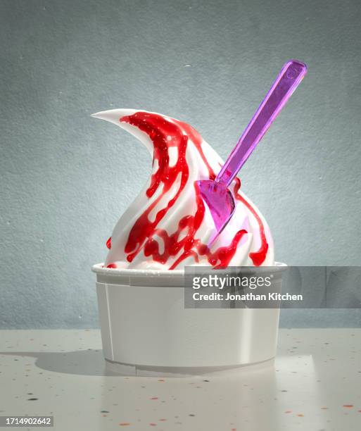 vanilla ice cream swirl with red sauce - ice cream sundae stock pictures, royalty-free photos & images