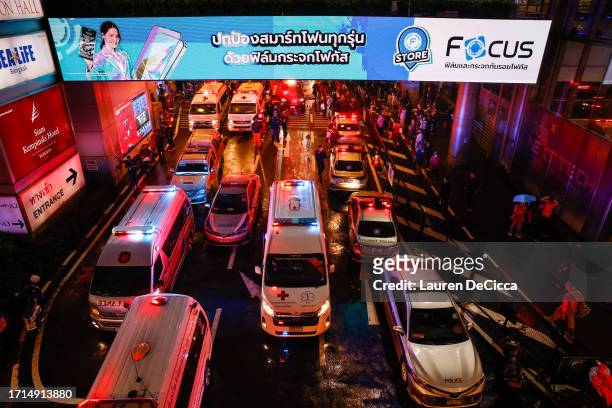 Emergency responders are seen outside the Siam Paragon mall after a shooting incident took place inside on October 03, 2023 in Bangkok, Thailand. A...