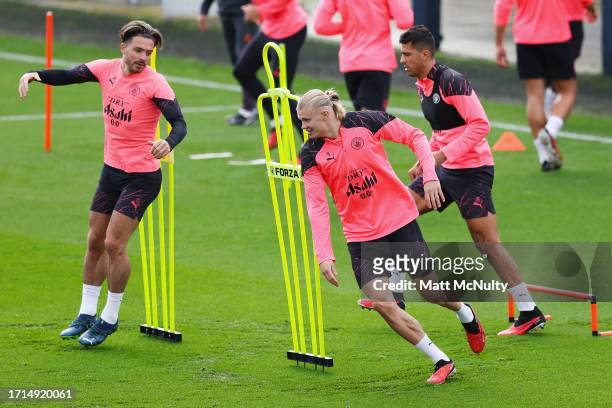 Erling Haaland of Manchester City warms up with teammates during a training session ahead of their UEFA Champions League Group G match against RB...