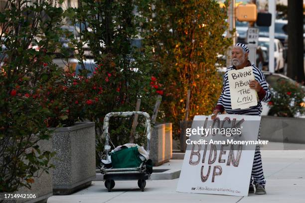 October 3: A protester stands outside of the J. Caleb Boggs Federal Building on October 3, 2023 in Wilmington, Delaware. Hunter Biden, son of U.S....