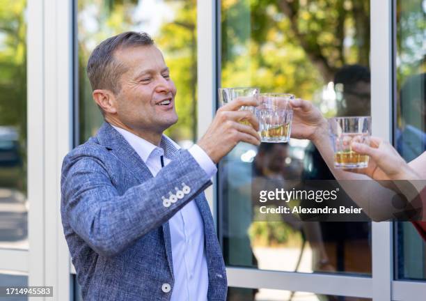 Ferenc Krausz toasts with champagne after co-winning the Nobel Prize in Physics on October 03, 2023 in Garching, Germany. Krausz, who works at the...