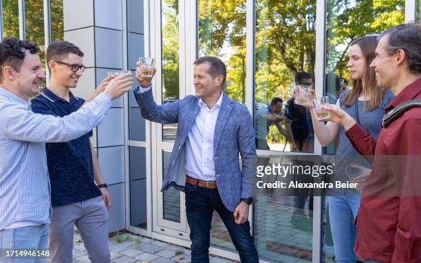 Ferenc Krausz and his team of the Max Planck Institute for Quantum Optics toast with champagne after co-winning the Nobel Prize in Physics on October...