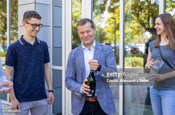 Ferenc Krausz opens a bottle of champagne after co-winning the Nobel Prize in Physics on October 03, 2023 in Garching, Germany. Krausz, who works at...