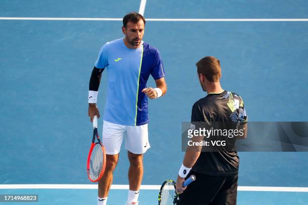 Ivan Dodig of Croatia and Austin Krajicek of the United States react in the Men's Doubles Semi-final match against Santiago Gonzalez of Mexico and...