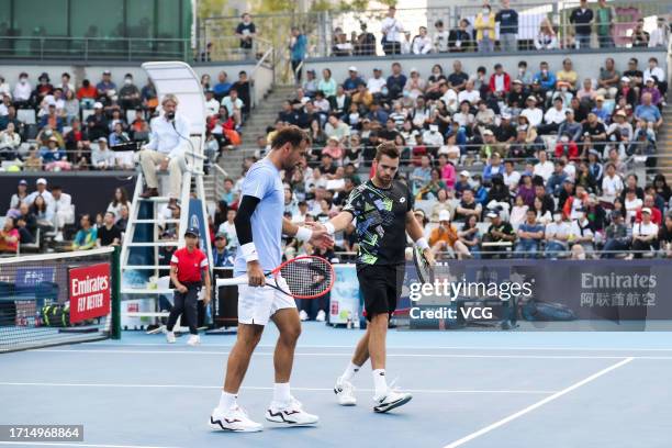 Ivan Dodig of Croatia and Austin Krajicek of the United States react in the Men's Doubles Semi-final match against Santiago Gonzalez of Mexico and...