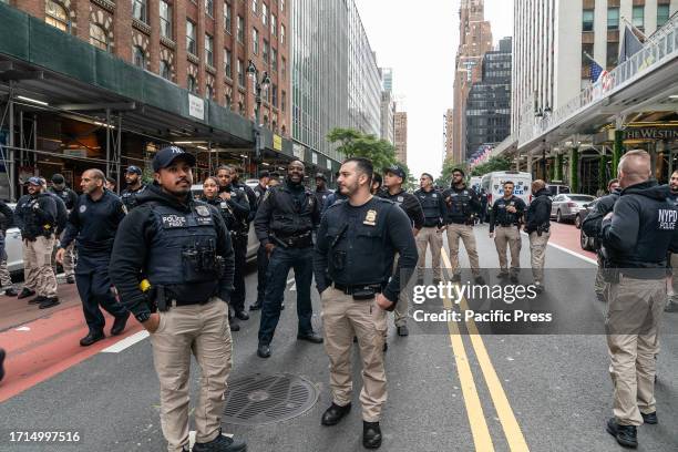 Police carefully separated both protests to prevent any clashes. Israeli and Palestinian supporters rallied around 42nd street for and against the...