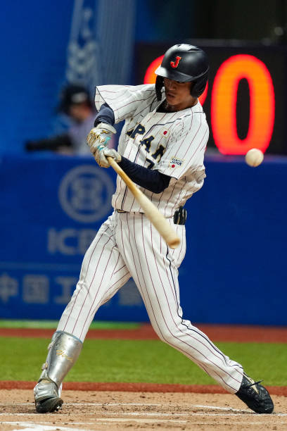 CHN: Japan v China: Baseball Preliminary Round Group A - The 19th Asian Games - Day 10