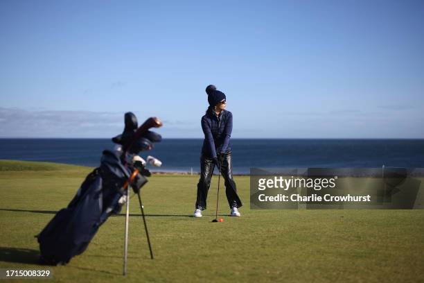 Catherine Zeta-Jones plays a shot during a practice round prior to the Alfred Dunhill Links Championship at Kingsbarns Golf Links on October 03, 2023...