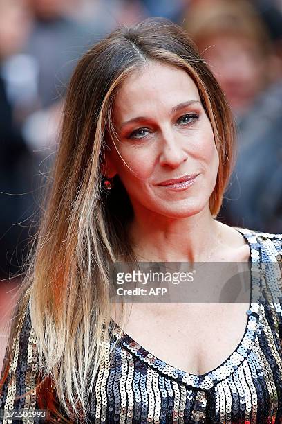 Actress Sarah Jessica Parker poses for photographers while arriving for the Premiere of West End musical Charlie and the Chocolate Factory, at the...