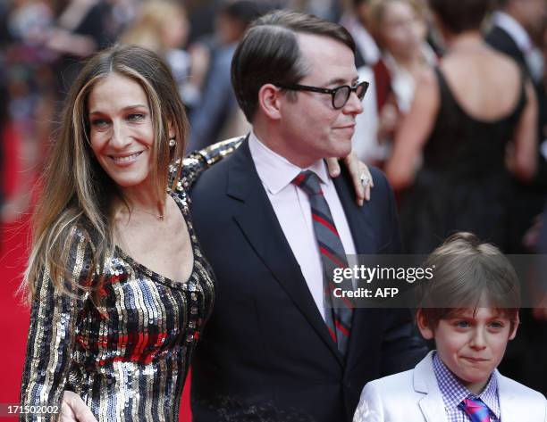 Actress Sarah Jessica Parker and US actor Matthew Broderick pose for photographers while arriving for the Premiere of West End musical Charlie and...