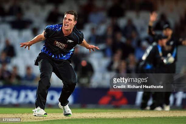 Mitchell McClenaghan of New Zealand celebrates taking the wicket of Luke Wright during the 1st Natwest International T20 match between England and...