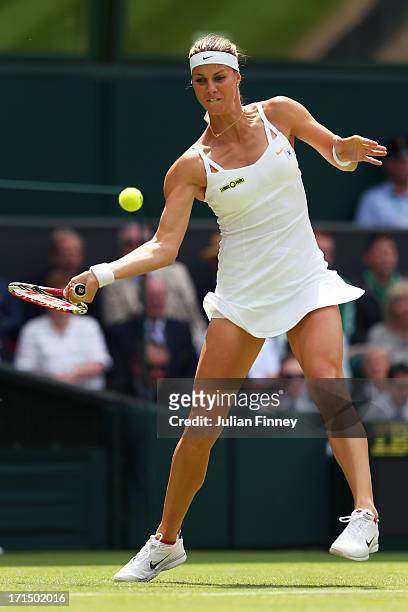 Mandy Minella of Luxembourg plays a forehand during her Ladies' Singles first round match against Serena Williams of the United States of America on...