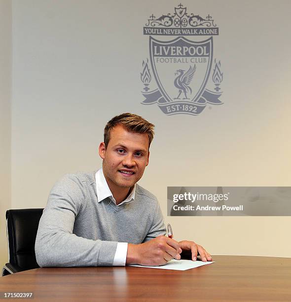 Simon Mignolet signs for Liverpool FC at Anfield on June 25, 2013 in Liverpool, England.