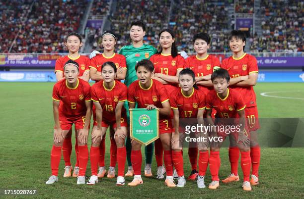 Players of Team China line up prior to the Football - Women's Semi-final match between China and Japan on day ten of the 19th Asian Games at Linping...