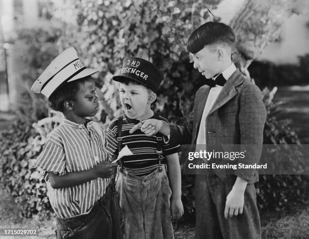 American child actors Billie 'Buckwheat' Thomas , Eugene Gordon Lee and Carl 'Alfalfa' Switzer in a still from one of producer Hal Roach's 'Our Gang'...