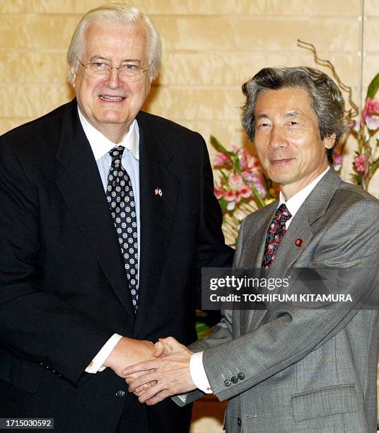 Chairman of the US House of Representatives International Relations Committee Henry Hyde is welcomed by Japanese Prime Minister Junichiro Koizumi at...