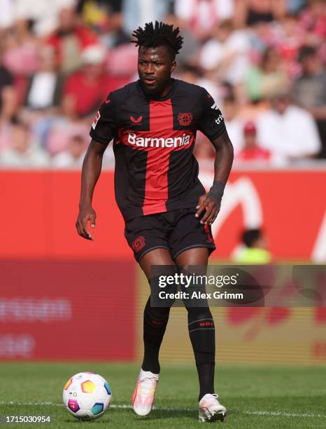 Edmond Tapsoba of Bayer Leverkusen controls the ball during the Bundesliga match between 1. FSV Mainz 05 and Bayer 04 Leverkusen at MEWA Arena on...