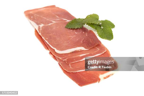 closeup on a piece of spanish serrano ham - cure 2013 stock pictures, royalty-free photos & images