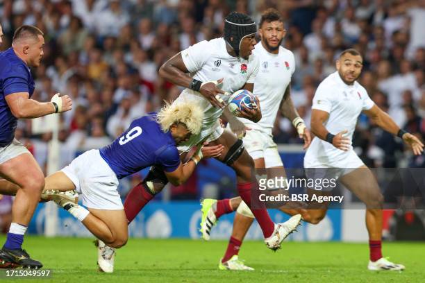 Maro Itoje of England is tackles by Jonathan Taumateine of Samao during the Rugby World Cup France 2023 match between England and Samoa at Stade...