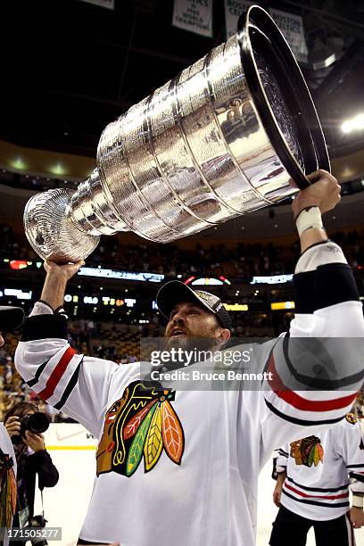 Viktor Stalberg of the Chicago Blackhawks celebrates with the Stanley Cup after winning in Game Six of the 2013 NHL Stanley Cup Final at TD Garden on...