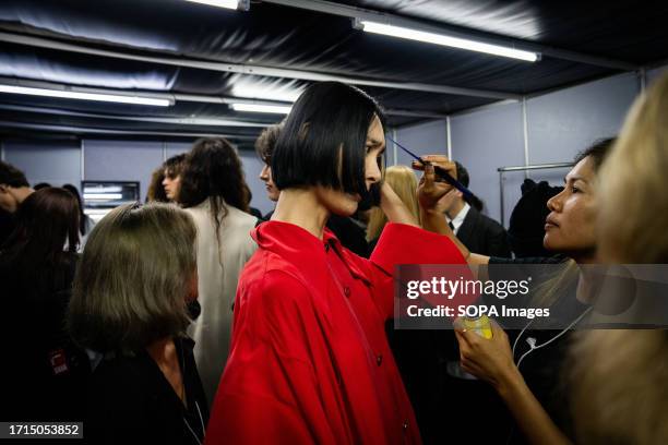 Model has their hair touched up backstage at the runway show. Day 3 of Bangkok International Fashion Week 2023 at Siam Paragon shopping mall in...