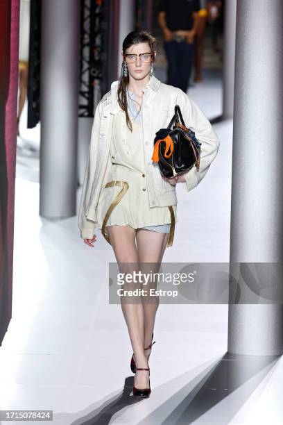 Model walks the runway during the Miu Miu Womenswear Spring/Summer 2024 show as part of Paris Fashion Week on October 3, 2023 in Paris, France.