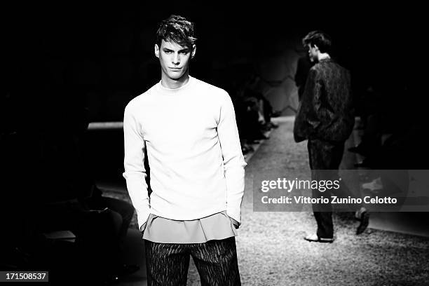 Model walks the runway at the Z Zegna show during Milan Menswear Fashion Week Spring Summer 2014 on June 25, 2013 in Milan, Italy.