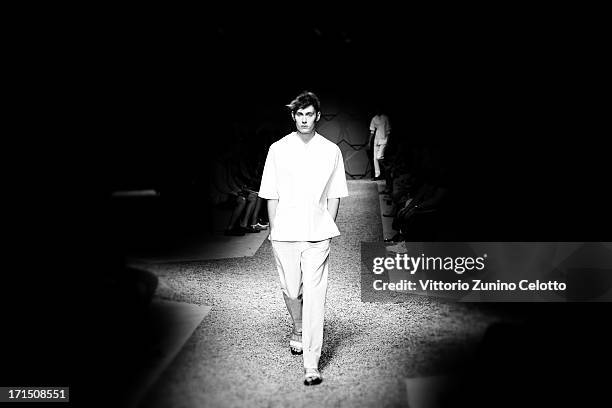 Model walks the runway at the Z Zegna show during Milan Menswear Fashion Week Spring Summer 2014 on June 25, 2013 in Milan, Italy.