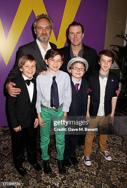 Sam Mendes and Douglas Hodge pose with Charlie actors Jack Costello, Tom Klenerman, Louis Suc and Isaac Rouse at an after party celebrating the press...