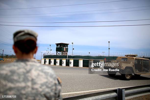 Sign reading, "Honor Bound", stands in front of Camp Delta which is part of the U.S. Military prison for 'enemy combatants' on June 25, 2013 in...