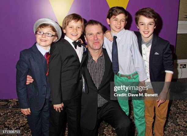 Douglas Hodge poses with Charlie actors Louis Suc, Jack Costello, Tom Klenerman and Isaac Rouse at an after party celebrating the press night...