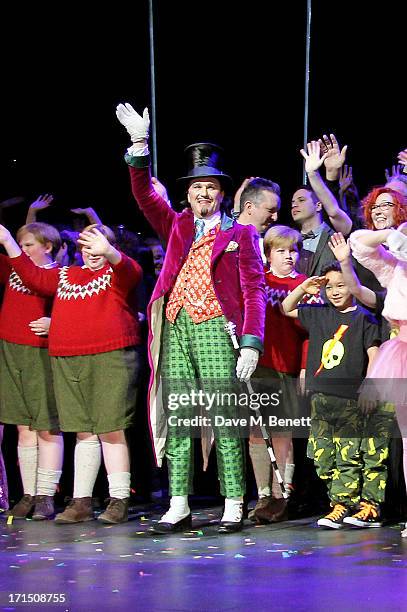 Cast member Douglas Hodge and cast bow at the curtain call during the press night performance of 'Charlie And The Chocolate Factory' at the Theatre...