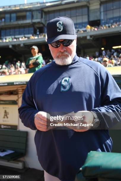 Manager Eric Wedge of the Seattle Mariners stands in the dugout prior to the game against the Oakland Athletics at O.co Coliseum on June 15, 2013 in...